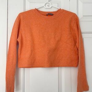 Cropped orange sweater